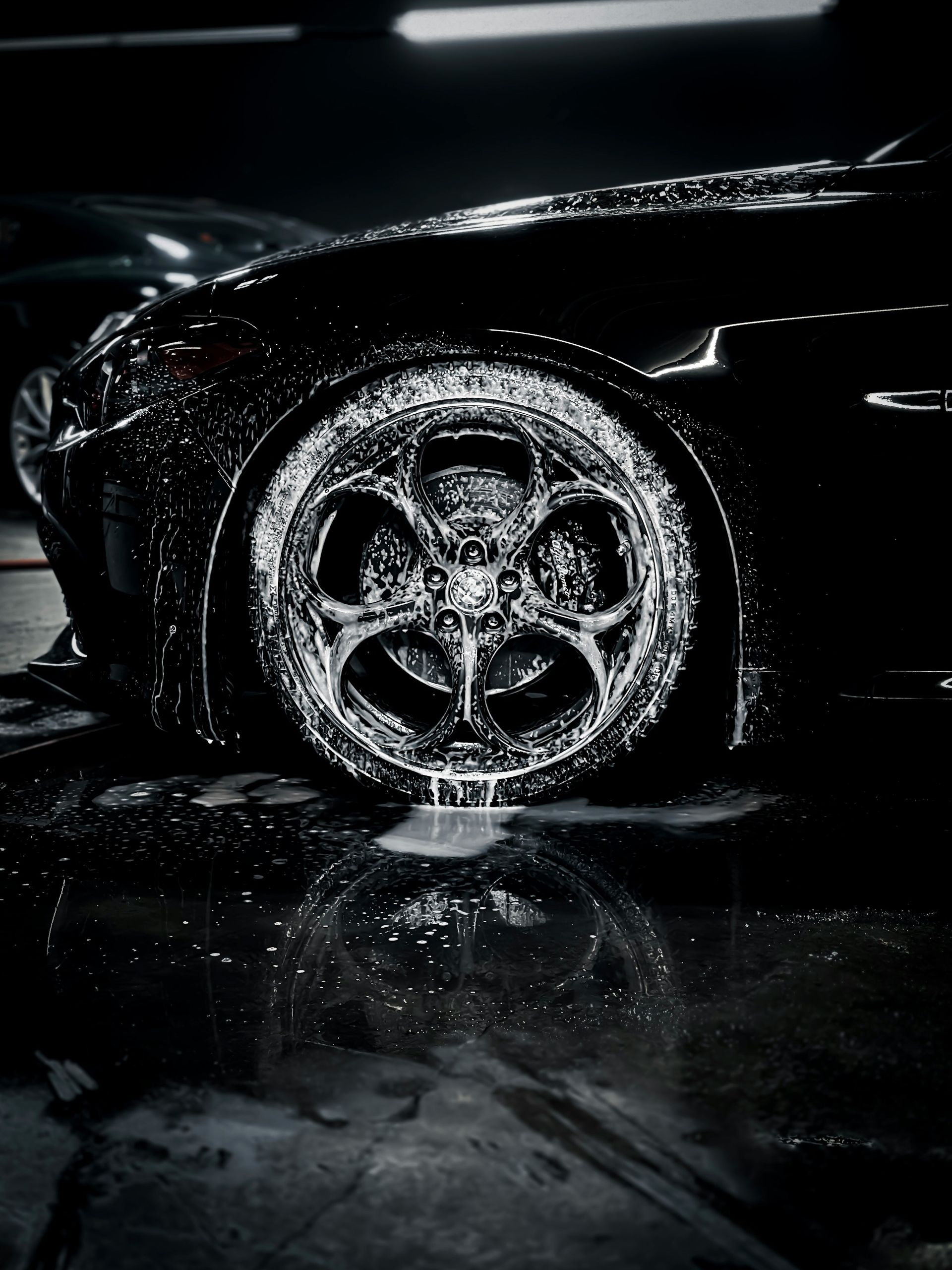 a close up of a car tire on a wet surface